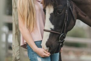 close up shot of girl and horse