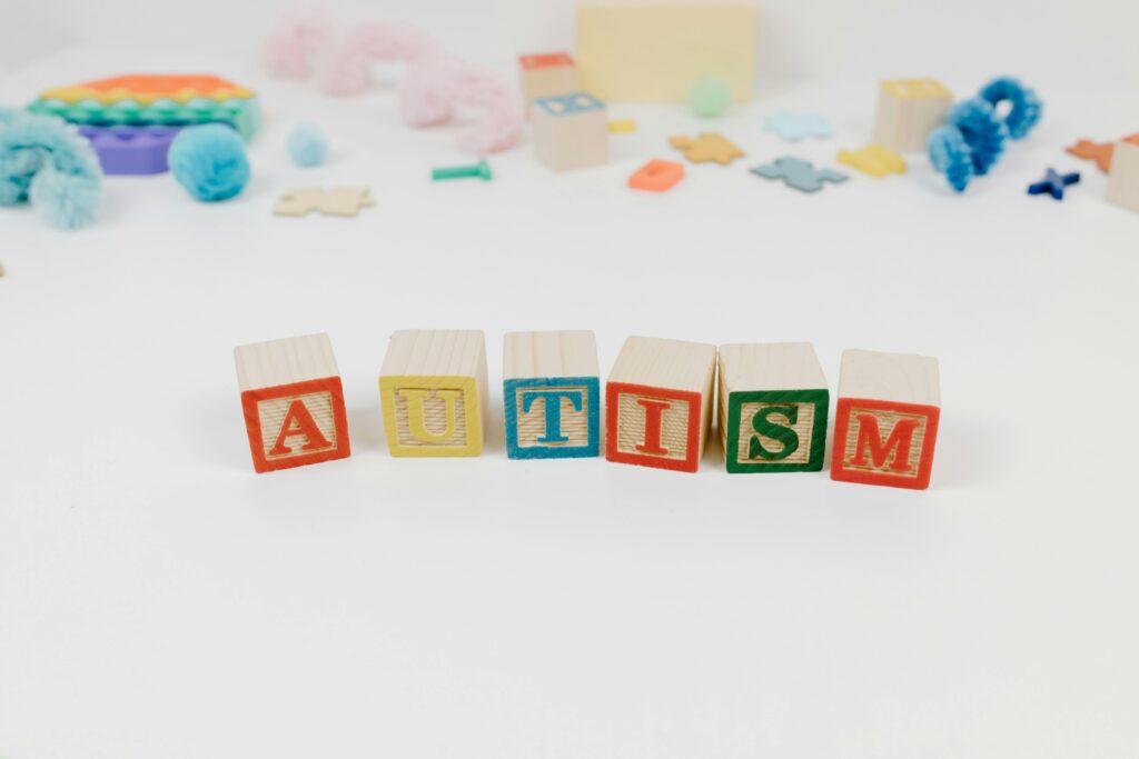 autism spelt with wooden letter blocks