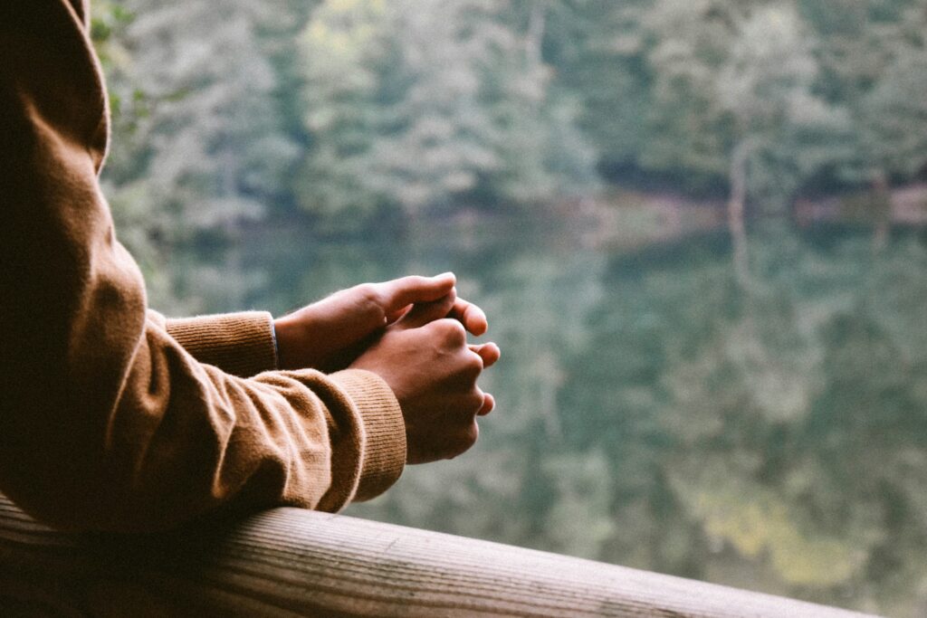 person overlooking water